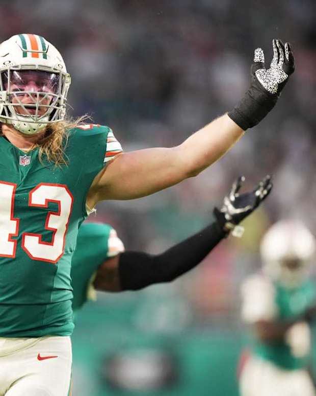 Miami Dolphins linebacker Andrew Van Ginkel (43) and linebacker David Long Jr., rear, celebrate a sack against the Dallas Cowboys during the first half of an NFL game at Hard Rock Stadium in Miami Gardens, Dec. 24, 2023.
